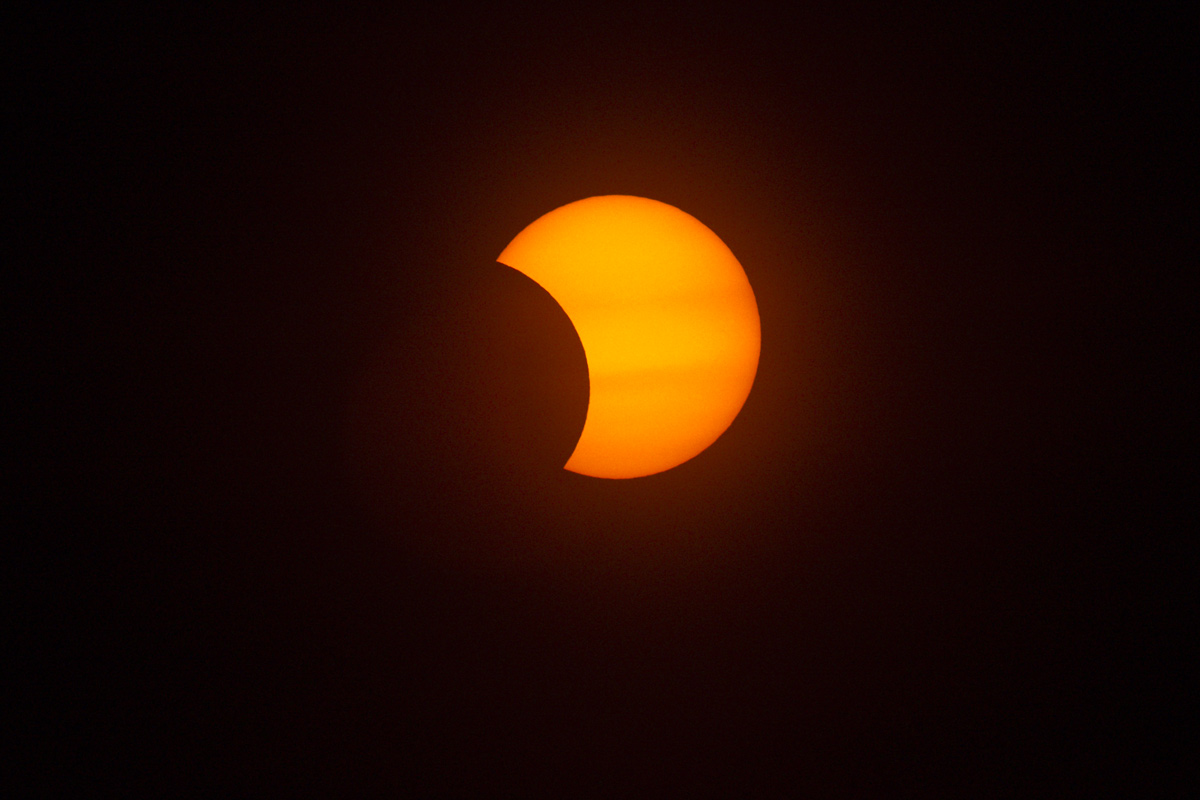 June 10, 2021  A partial solar eclipse at this latitude was visible through the morning mist.